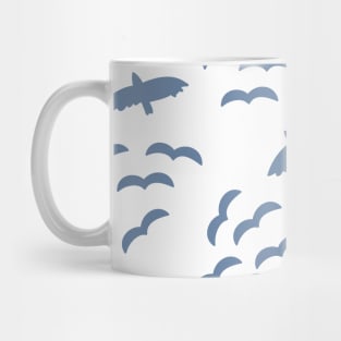 Silhouettes of flying birds. Bird silhouettes blue on a white background. Flock of birds. Swarm of birds. Eagle. Seahawk. Mug